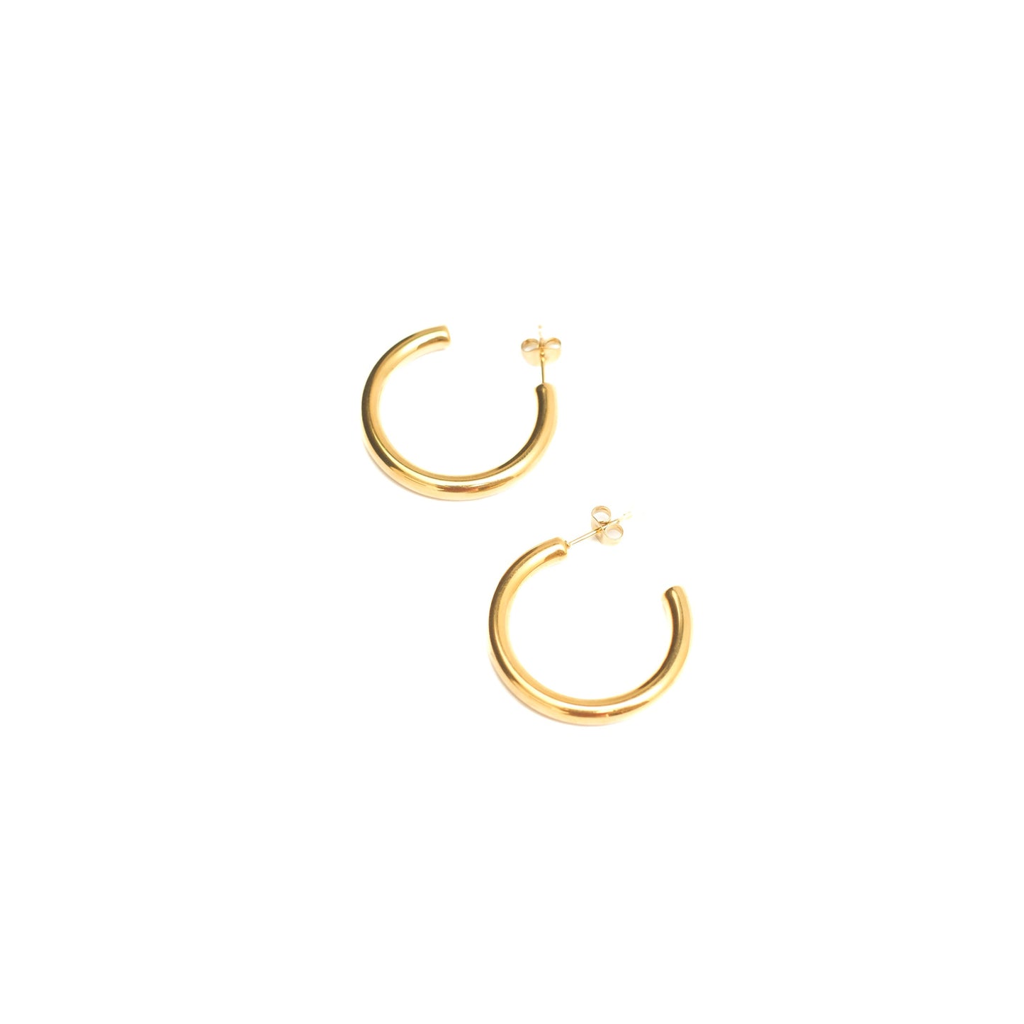 Gold hoop earrings on a white background